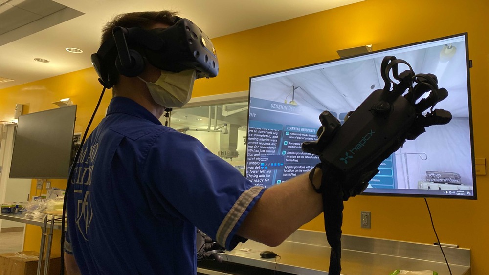 Emergency medical technician explores virtual medical training using haptic technology. 